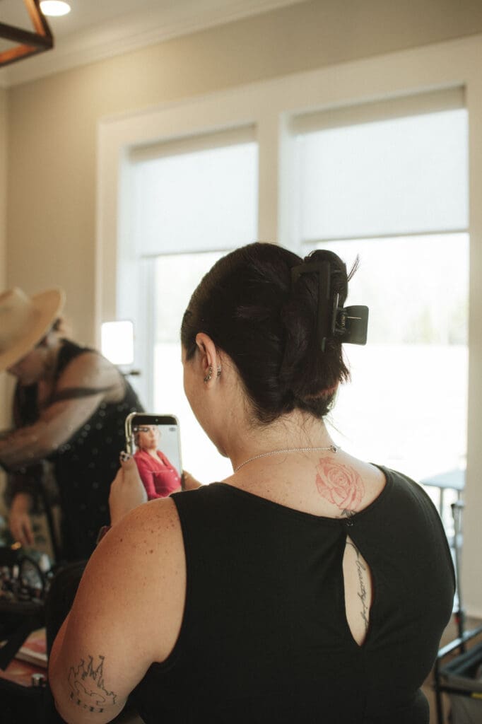 Wedding content creator capturing candid behind-the-scenes moments with a bride on her wedding day.