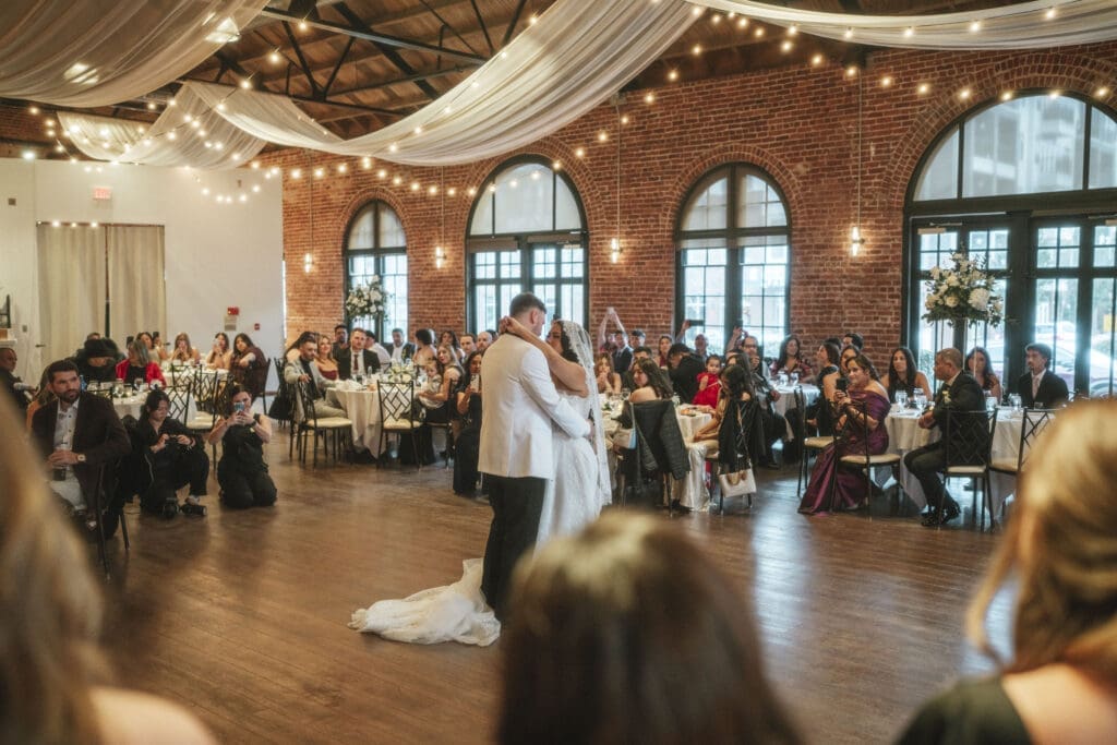 Wedding content creator working alongside a wedding photographer during a luxury wedding reception in downtown greenville